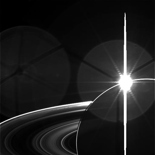 A raw image taken by the Cassini Spacecraft of the Sun appearing to set behind Saturn. Credit: NASA/JPL-Caltech/Space Science Institute.  Image available at this link: http://saturn.jpl.nasa.gov/photos/raw/rawimagedetails/index.cfm?imageID=83606 